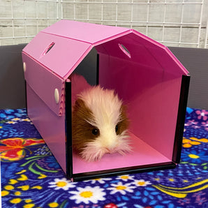 pink tunnel hidey for guinea pigs in a c&c cage