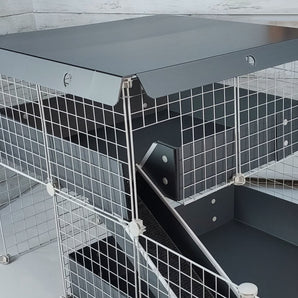 wide silver canopy showing its hinges atop a loft on a silver c&c guinea pig cage