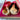 Two guinea pigs sitting comfortably in a pink hidey tent