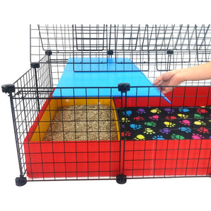 Covered starter kit with a red C&C guinea pig cage and colorful kitchen suite